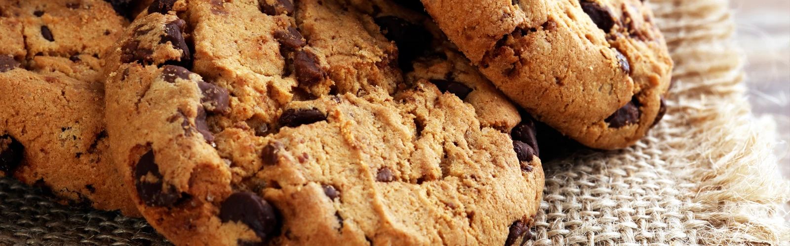 Chocolate chip cookies on a hessian cloth